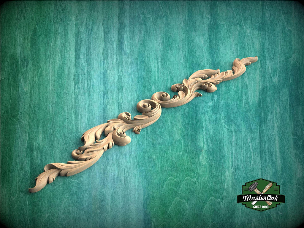 A decorative wooden carving in the shape of a scroll or ribbon is displayed against a green textured background.