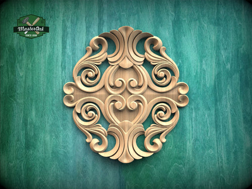 a decorative wooden carving on a green background.
