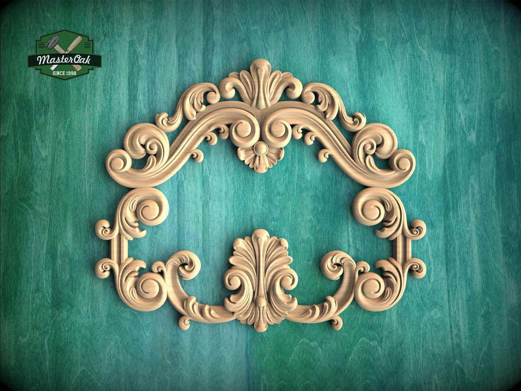 an ornate, carved wooden frame with intricate scrollwork and floral designs, set against a green background.