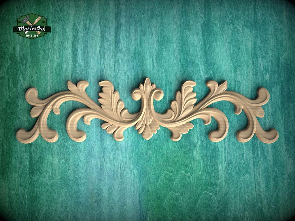 a decorative wooden carving on a teal background.