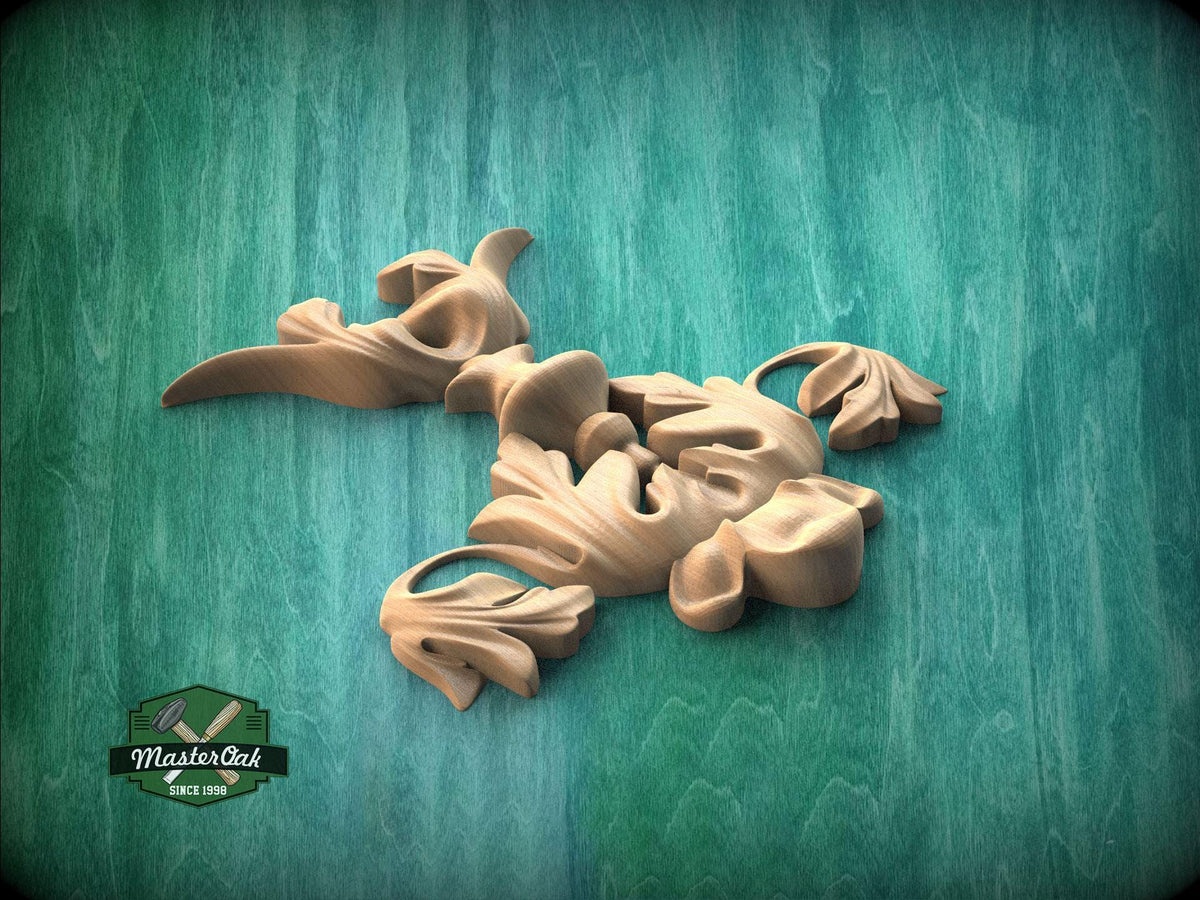 a collection of wooden sculptures or carvings, including a bird-like figure, arranged on a green textured background.