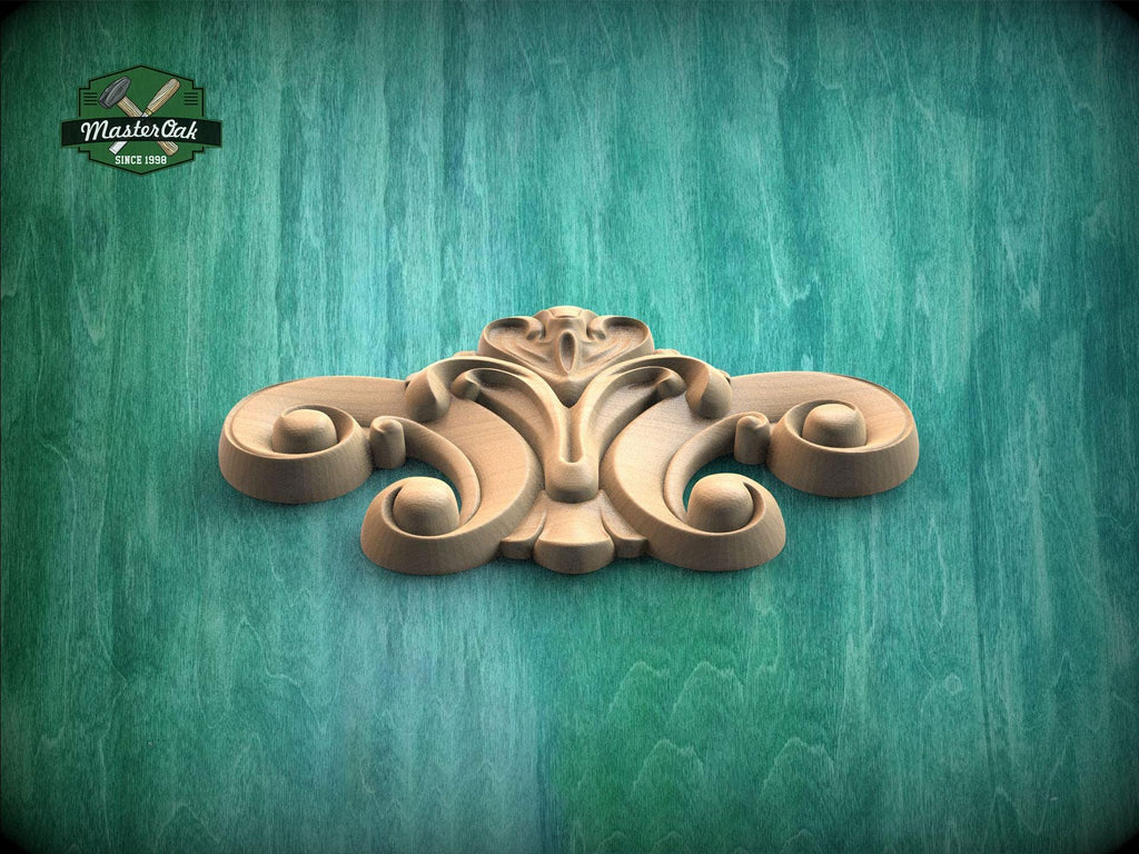 A wooden carving with an intricate, decorative design is displayed against a green textured background.