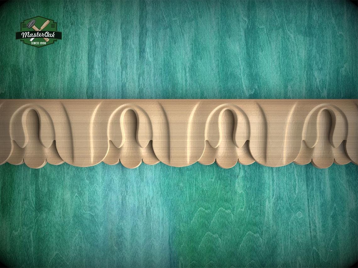 a decorative wooden border with a repeating pattern of carved shapes, set against a textured green background.