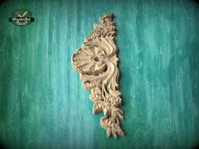 Load image into Gallery viewer, a decorative wooden carving on a green background.
