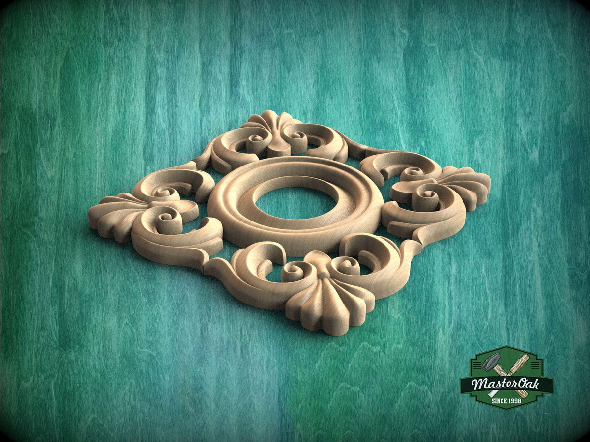 A decorative wooden panel with intricate floral and scrollwork designs, set against a green textured background.