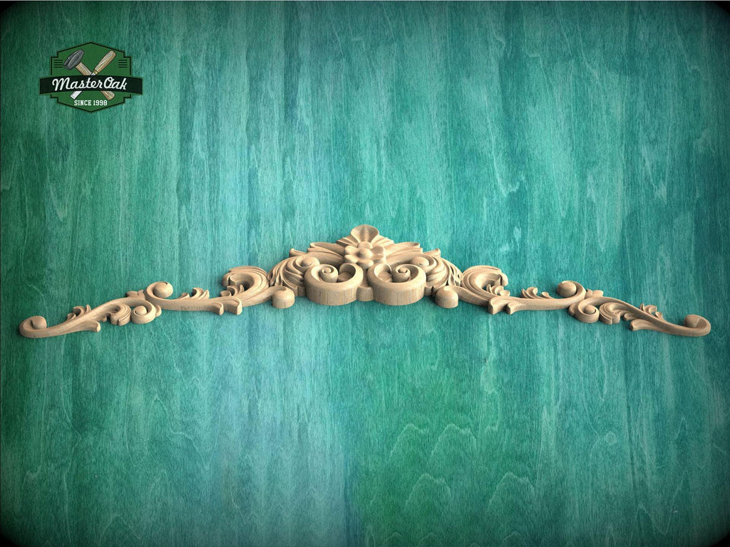 a wooden carving of a flower on a green background