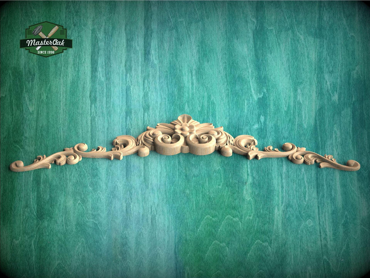 a wooden carving of a flower on a green background