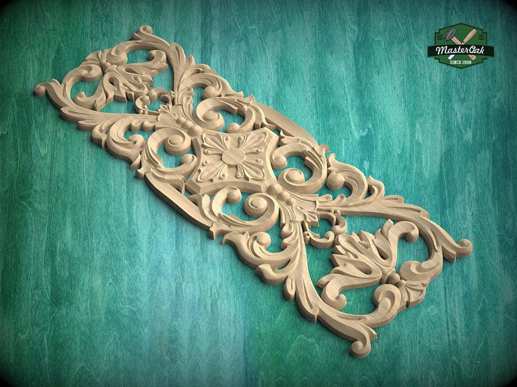 an ornate, carved wooden piece with intricate floral and scroll designs, set against a green background.