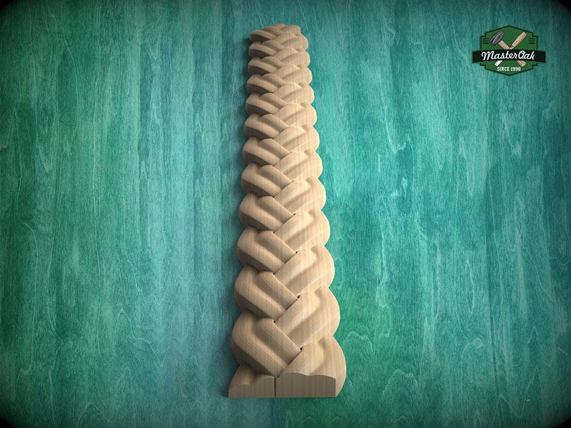 A wooden carving of a braided pattern is displayed against a green background.