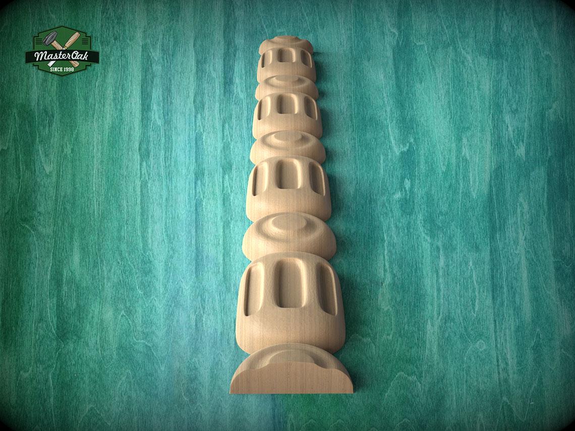 A wooden carving of a tall, cylindrical object with a series of smaller cylindrical shapes stacked vertically, set against a green textured background.