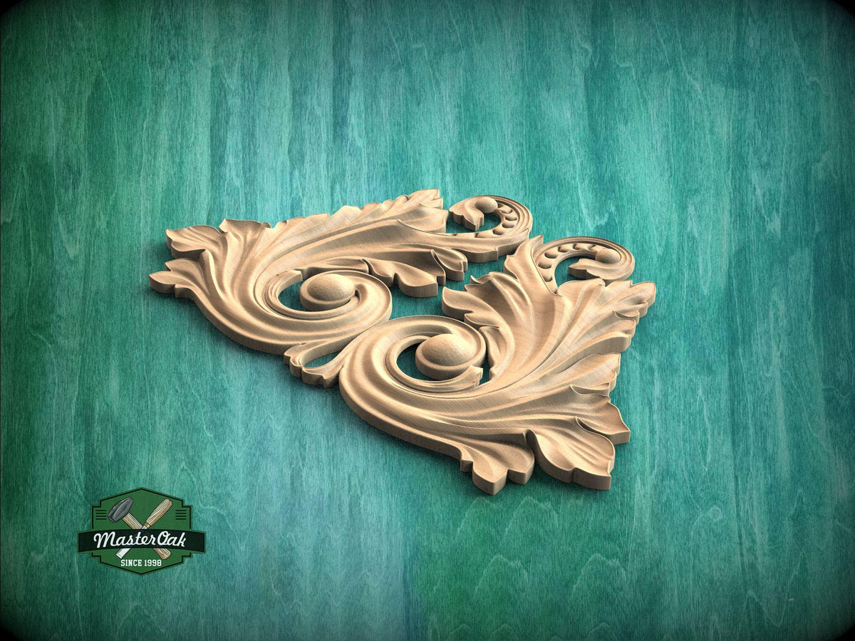 A decorative wooden carving in the shape of a leaf or flower is displayed against a green background.
