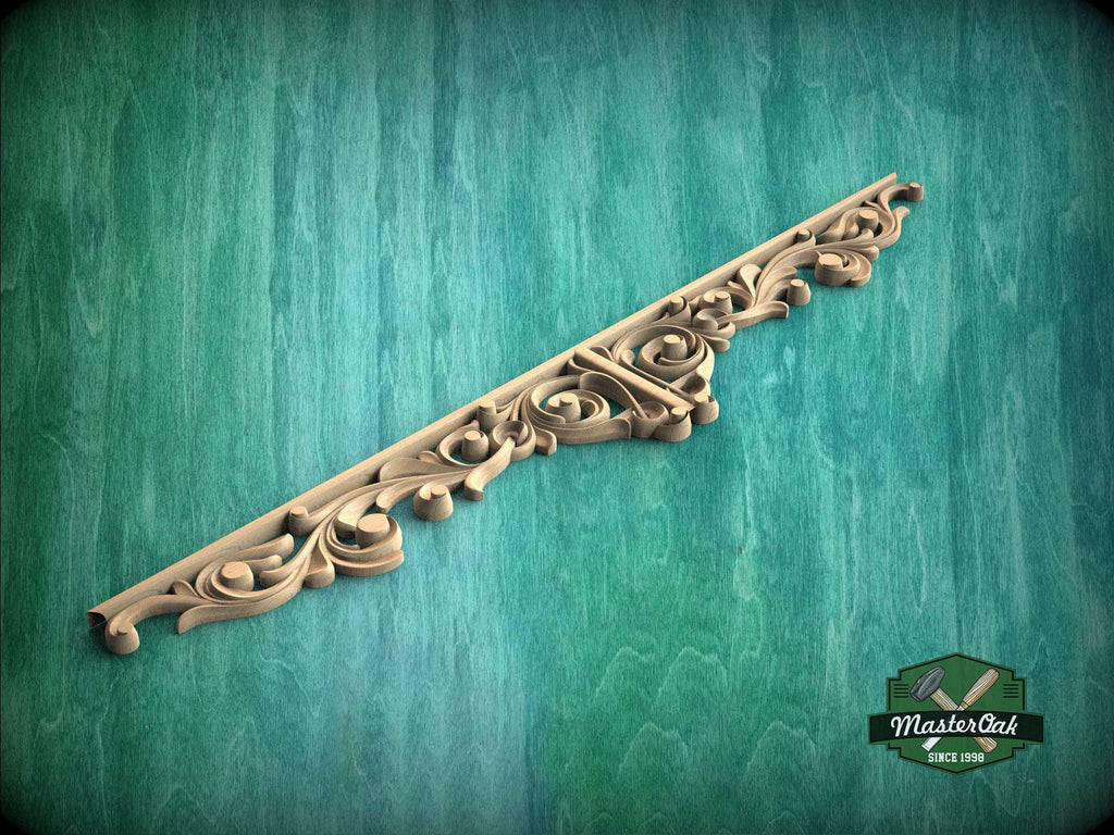 A decorative wooden carving or mold is shown against a green textured background.