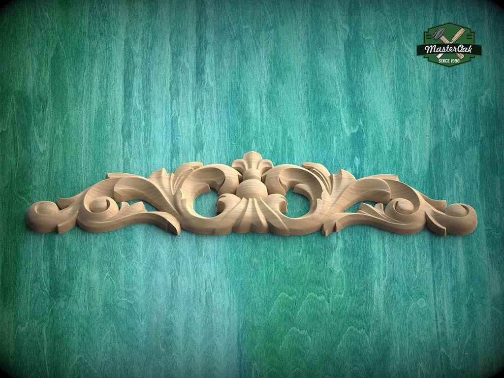 A decorative wooden carving with intricate scrollwork is displayed against a teal-colored background.