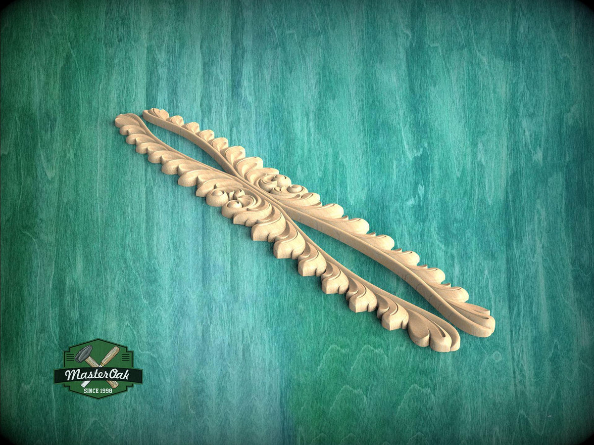 A decorative wooden leaf or branch with intricate carvings is displayed against a green background.