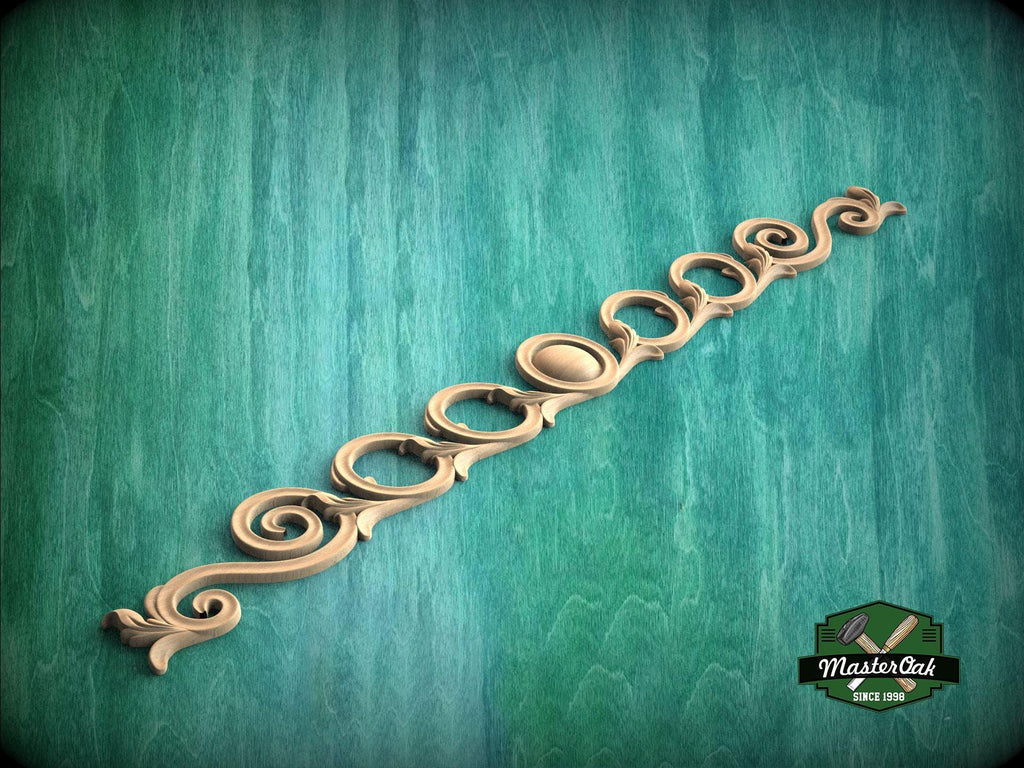a decorative wooden piece with a curved design, placed against a green background.