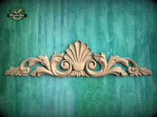 Load image into Gallery viewer, a decorative wooden carving on a green background.
