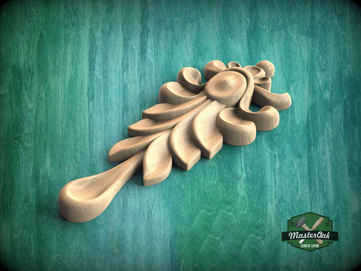 A wooden carving of a leaf-like design is displayed against a green background.