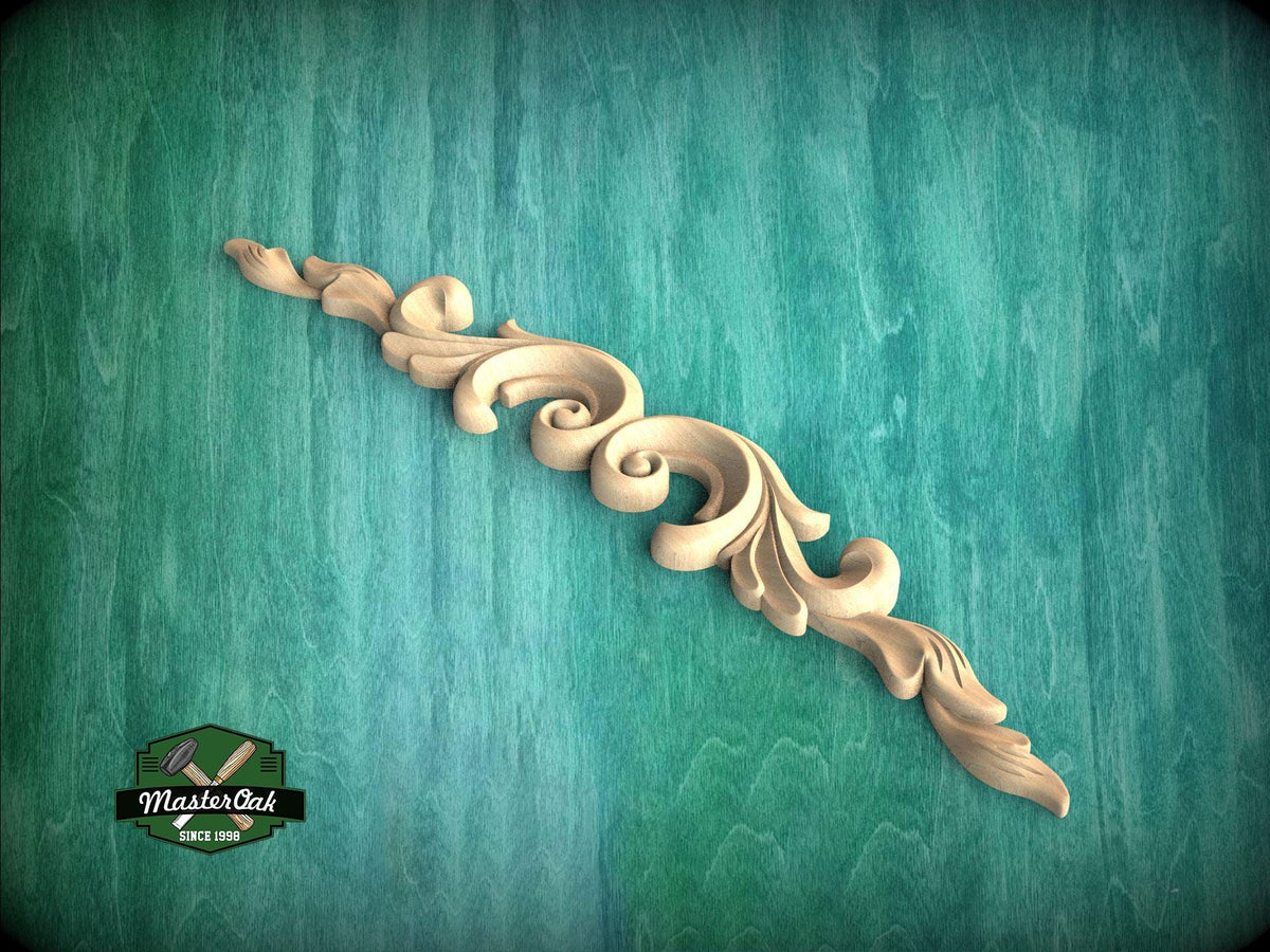 A decorative wooden carving with a scroll-like design is displayed against a teal-colored background.