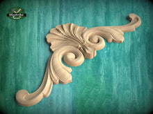 Load image into Gallery viewer, A wooden carving of a decorative finial or scroll is displayed against a green background.
