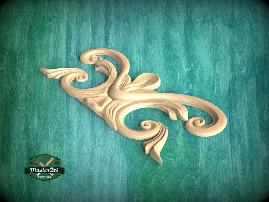 A wooden carving of an ornate, curving design is displayed against a teal background.