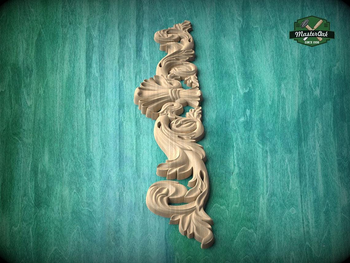 A decorative wooden carving in the shape of a bird is displayed against a green textured background.