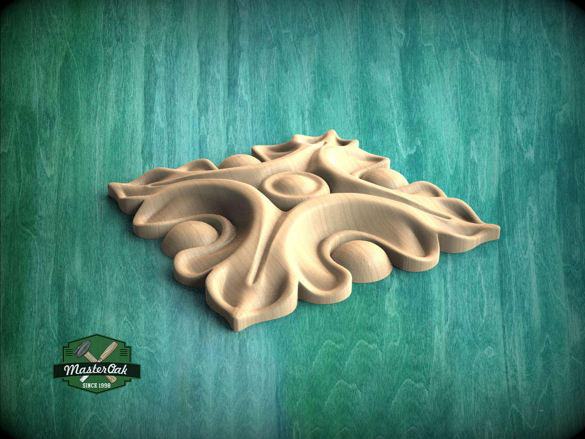 A wooden carving of a stylized leaf or flower design is displayed against a green background.