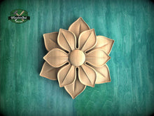 Load image into Gallery viewer, A wooden flower carving is displayed against a green background.
