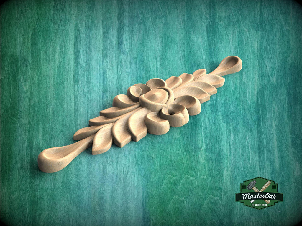 A wooden carving with a floral design is displayed against a green background.