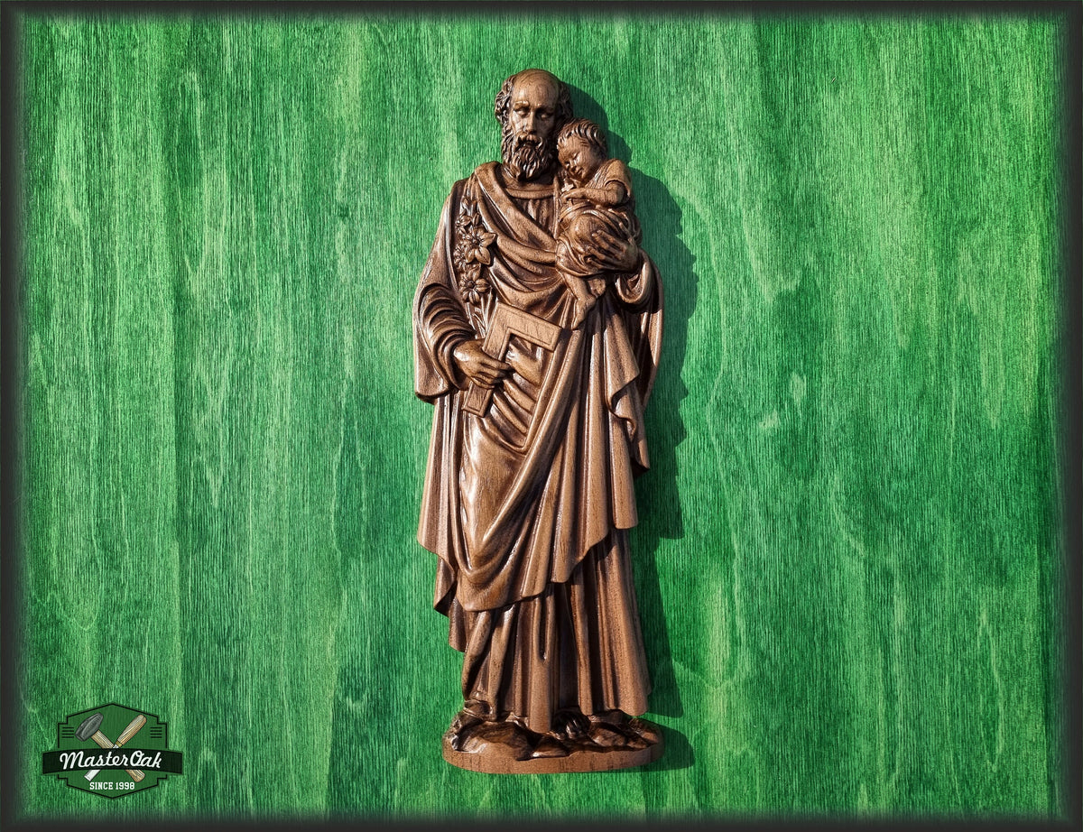 May include: A wooden carving of Saint Christopher carrying a child on his shoulder. The carving is painted in a brown color and has a detailed design. The carving is set against a green background.