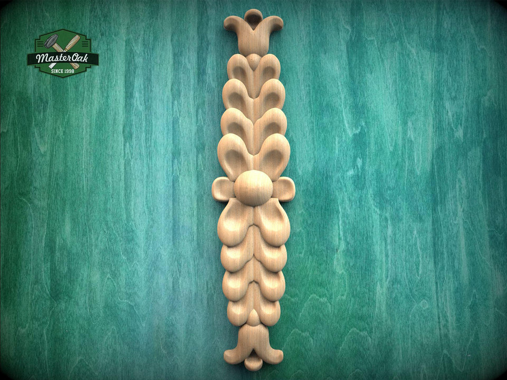 a decorative wooden carving on a green background.