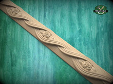 Load image into Gallery viewer, a decorative wooden trim with a floral design, set against a green background.
