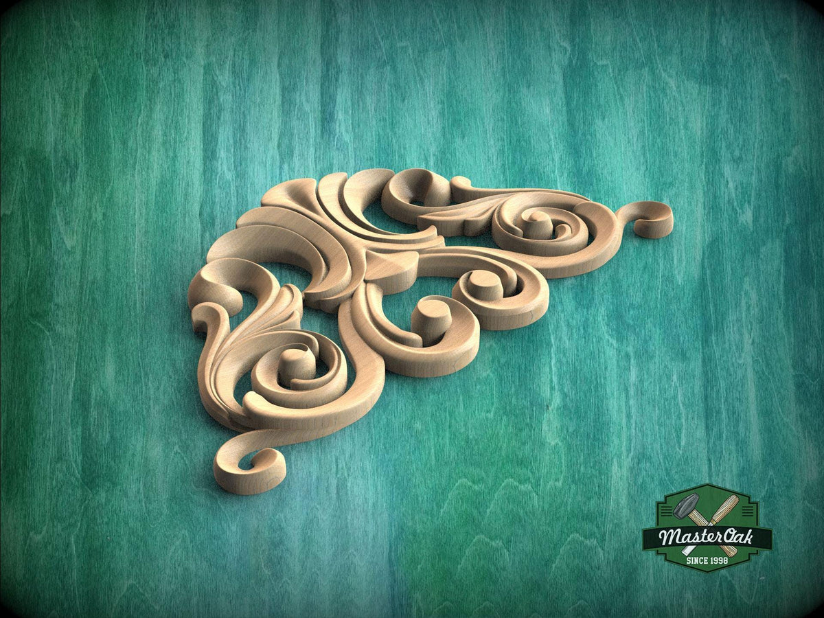 A decorative wooden carving in the shape of a swirl or floral pattern is displayed against a teal-colored background.