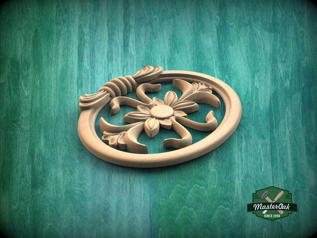 A wooden ornamental piece with a floral design, placed on a green textured background.
