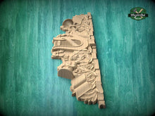 Load image into Gallery viewer, A wooden carving of a bird or bird-like figure is displayed against a green background.
