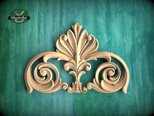a decorative wooden carving on a green background.