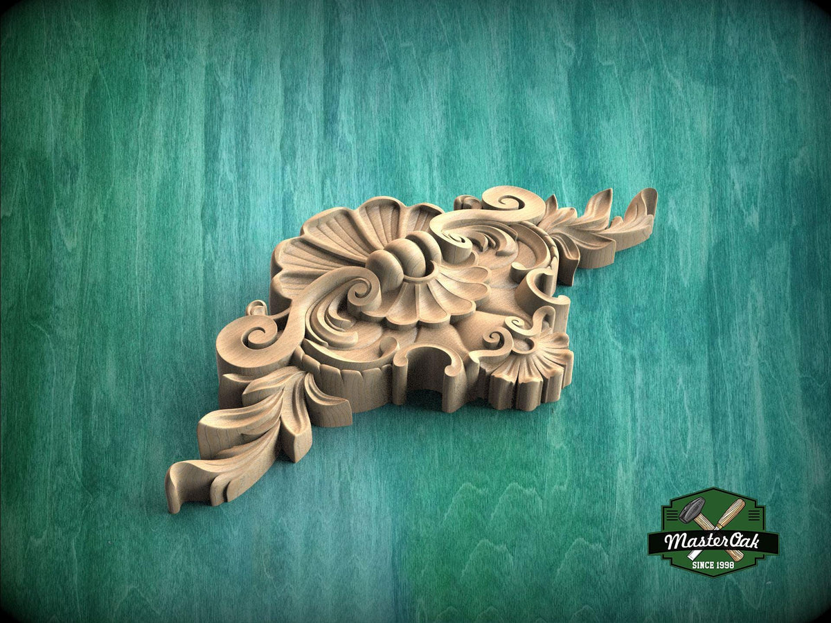 A carved wooden ornament with intricate floral and leaf designs is displayed against a green background.
