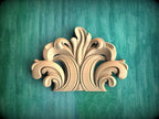 a decorative wooden carving on a green background.