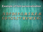 a close-up of a wooden surface with the letters of the alphabet arranged in a decorative font, representing an example of font personalization.