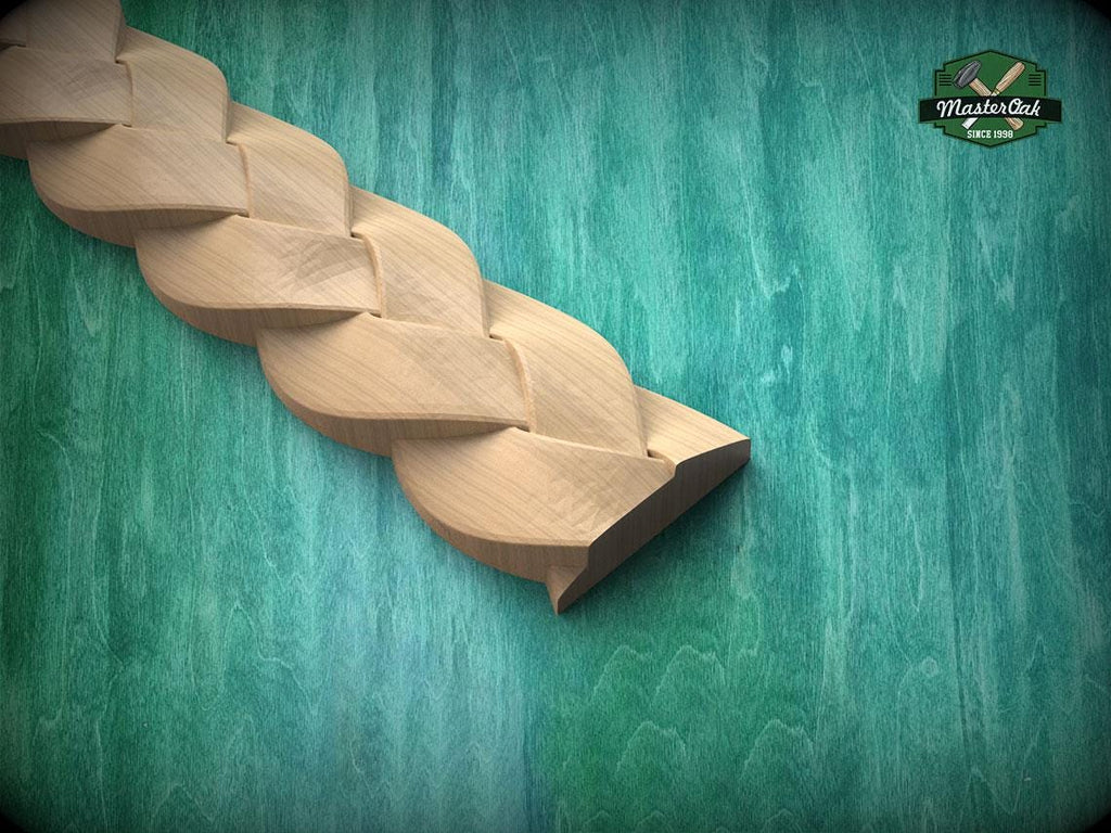 A wooden braided object rests on a green wooden surface, with a logo visible in the top right corner.