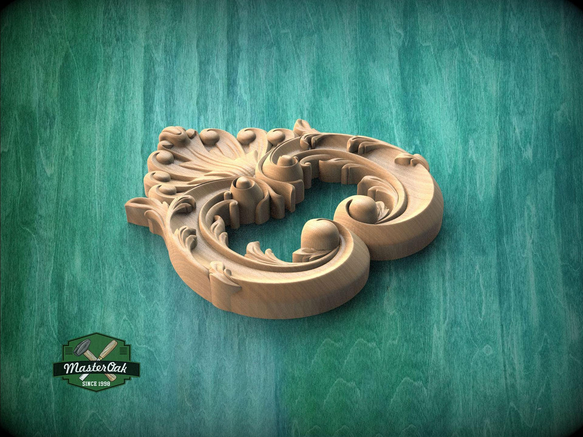A wooden carving with intricate floral and scroll designs is displayed against a green textured background.