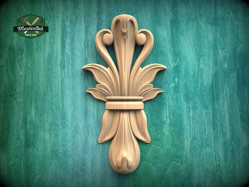 a decorative wooden carving of a stylized flower or plant on a green background.