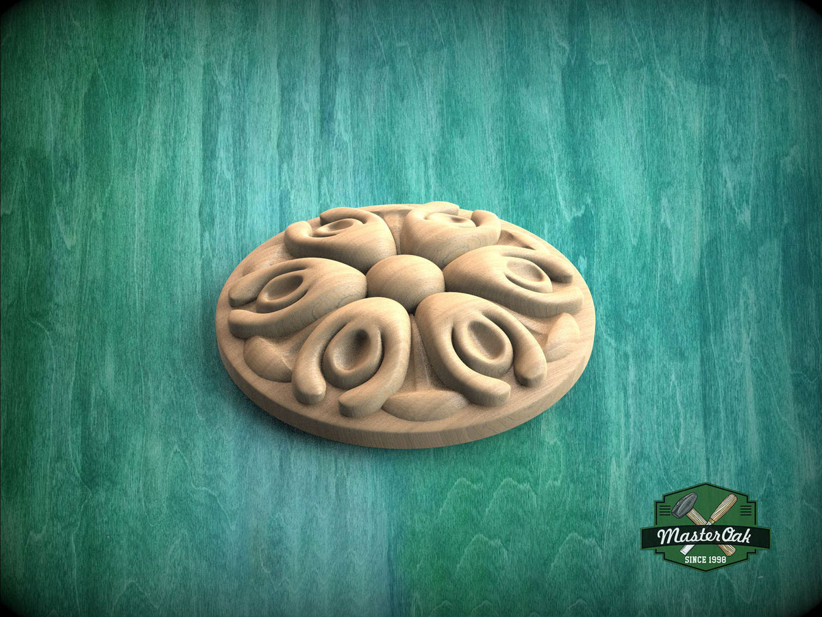 A wooden ornamental piece with a floral design, placed on a green textured background.