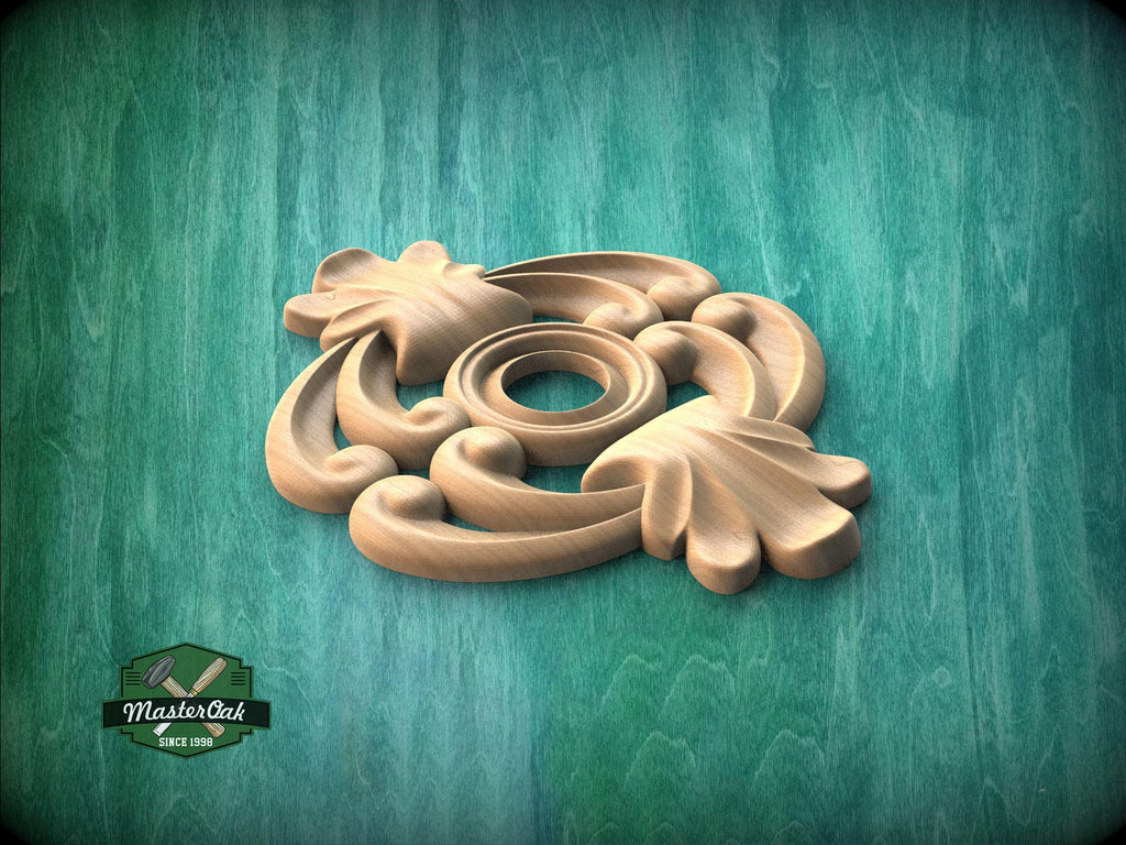 A wooden carving with intricate floral designs is displayed against a green background.