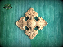 Load image into Gallery viewer, a decorative wooden piece with an intricate design, placed against a green background.
