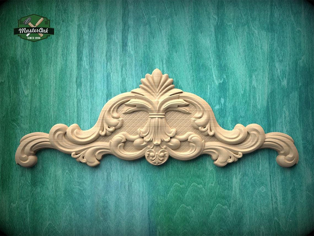 a decorative wooden carving on a green background.