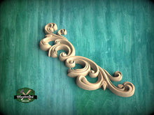 Load image into Gallery viewer, a green background with a decorative design on it
