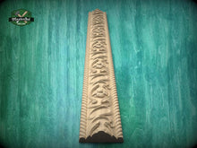 Load image into Gallery viewer, a decorative wooden carving on a green background.
