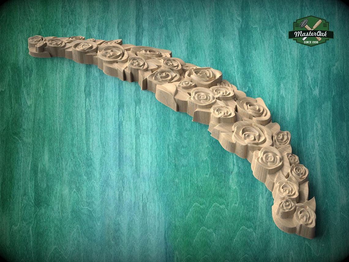 A wooden carving of a rose-shaped object with intricate details, displayed against a teal background.
