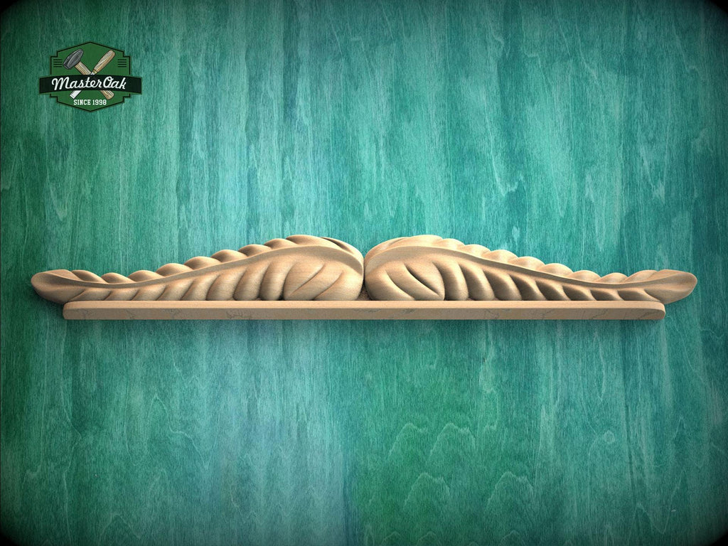 A wooden shelf with a decorative leaf-like design on it, set against a green textured background.