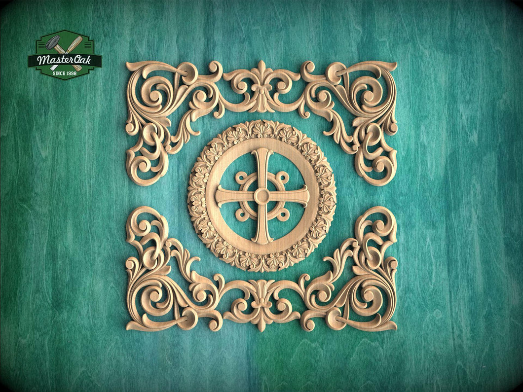 an ornate, carved wooden design with intricate scrollwork and a central motif, set against a teal background.